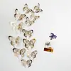 Pegatinas de pared autoadhesivas 3D tridimensionales de mariposa hueca de corte de papel de diez colores, pegatinas de decoración para pared de fondo DIY para el hogar LK07