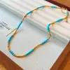 Aretes y collar de flor de piedra chapados en oro real de 18 quilates, nueva cadena para clavícula retro estilo chino, juego de joyería de nicho de lujo ligero