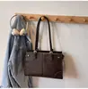 Bolso grande de alta gama para mujer, nuevo bolso de hombro/bajo el brazo retro de nicho para el otoño de 2026, bolso tote casual para el trabajo
