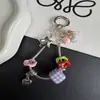 Colgante único para bolso con cadena de hueso de serpiente de metal, cadena para teléfono de cachorro creativa, colgante para llaves