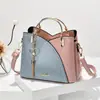 Bolso de mujer Taizhou 2024 nueva tendencia portátil coreano color de contraste gran capacidad moda hombro bandolera una generación de pelo