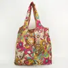 Bolsa de almacenamiento portátil para supermercado de exportación en stock mediana bolsa de compras bolsa de protección ambiental bolso de mano bolsa de compras plegable nailon