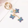 Llavero de Mariposa con Goteo de Aceite Versátil de Moda Llavero de Mariposa con Flor Colgante para Bolso de Mujer Regalos Pequeños Exquisitos Venta al por Mayor