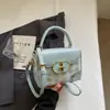 Bolso pequeño rosa a cuadros súper popular para mujer, nuevo bolso cruzado versátil de moda 2026, bolso cuadrado pequeño informal tipo caja estilo coreano