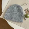 Gorro de punto de color liso estilo coreano con patrón circular, holgado, cálido y perfecto para otoño e invierno. Tiene un estilo relajado, moderno y versátil, lo que la convierte en un gorro de punto simple y cálido.
