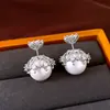 Pendientes de botón redondos de perla con circonita y aguja de plata para mujer, estilo elegante francés, pendientes de lujo ligero, diseño de nicho, accesorios para orejas versátiles