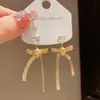 Pendientes retro franceses simples de corazón de circón con lazo de metal, pendientes elegantes, de lujo ligero, dulces y versátiles para mujer