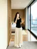 Hermoso conjunto deportivo casual estilo coreano para mujer, conjunto de dos piezas de verano reductor de edad y adelgazante con top de manga corta de seda helada y pantalones tipo falda de pierna ancha