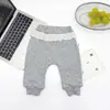 Pantalones de forro polar para niñas con estampado de lunares para otoño e invierno, con ribete de encaje y cintura fruncida, pantalones jogger para bebé al por mayor