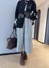 Estilo temperamento quente ao coração emagrecedor quente calças de perna larga de oito pontos calças bootcut espessadas Outono/Inverno 2026 H101002