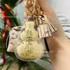 Llavero de oro puro 999, bolsa pequeña de cuero, bolsa de la suerte, colgante popular Shuibei de buena suerte y fortuna, regalo de vacaciones al por mayor