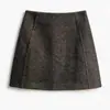 Toma real de la minifalda de lana compuesta de sarga estilo americano picante para mujer, otoño 2026, anti-exposición, adelgazante, línea A, bodycon