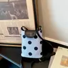 Moda de verão transfronteiriça bolsa pequena feminina 2026 nova bolsa de balde de bolinhas de verão simples bolsa de ombro crossbody para celular