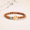 [Estilo celebridade da internet] Pulseira de pêssego garra de gato carvão raiz de Bodhi pulseira feminina jade branco natural Bodhi atacado