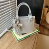 Bolso Cubo de Mano Fresco de Nicho Estilo Coreano 2026 Nuevo Moda Versátil Bolso Cruzado Simple para el Trabajo Diario Bolso de Hombro Único