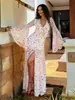 Vestido floral de chifon transfronteiriço, estilo de férias europeu e americano, decote V sexy, cintura com renda, vestido longo com fenda para mulheres
