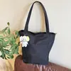 Bolsa tote de lona de alta qualidade e estilosa em estilo japonês, perfeita para o uso diário, com grande capacidade, adequada para estudantes e pessoas que se deslocam para o trabalho, e pode ser carregada como uma bolsa de ombro.
