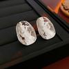 Brincos de metal irregular agulha de prata Europa e Estados Unidos transfronteiriços brincos vento frio simples luz de luxo brincos de alto senso fabricantes