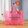 Bolsa transparente de cor mágica a laser de PVC formulada Bolsa de ombro de celebridade da Internet Saco de presente de embalagem de geléia Saco de compras de plástico