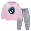 Conjunto de Roupas Infantis Estilo Coreano Novo para Primavera e Outono de 2026: Conjunto de Moletom e Calça Longa Infantil, Roupa de Algodão com Manga Longa Tiktok
