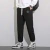 Calça casual versátil de veludo cotelê para outono para homens, nova calça jogger patchwork de corte solto, calça de moletom esportiva de marca da moda