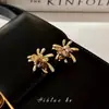 Brincos Maillard Olho de Tigre Dourado para Mulheres, Luxo Leve, Brincos de Alta Qualidade e Elegantes, Brincos Únicos de Nicho Outono e Inverno Atacado