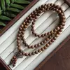 Pulsera de madera de ala de pollo antigua con alto pulido, cuentas de madera lisas, hilo de mano coleccionable para el ocio, venta al por mayor disponible en tiendas físicas, lugares escénicos y ferias de templos.