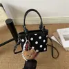 Design de bolsa retrô senso de nicho bolsa de mão feminina 2026 nova bolsa de balde de camurça e pelúcia de bolinhas bolsa de ombro única transversal