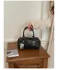Bolso de mano de diseño de nicho nuevo para comercio transfronterizo, elegante bolso tipo bowling para el hombro y cruzado para el día a día con patrón tejido para mujer