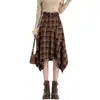 Falda retro de cuadros estilo coreano línea A para mujer, irregular otoño e invierno retazos casual de cintura alta longitud media, nuevo modelo 2026