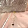 Bestseller transfronterizo: Collar de borlas en forma de Y de margarita para mujer, lujo ligero con un toque de alta gama, nicho y no se decolora