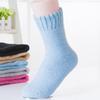 Suministro transfronterizo de calcetines de mujer de color liso, calcetines de rizo tipo toalla para mujer, calcetines de lana de conejo engrosados, calcetines alargados
