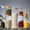 Fábrica al por mayor, frasco sellado de vidrio de borosilicato de alta calidad, frasco de té con tapa de bambú, frasco de vidrio transparente para almacenar dulces.
