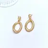 Pendientes Geométricos Huecos Exagerados de Círculo Electroplateado Transfronterizos para Mujer, Pendientes y Accesorios para Orejas Simples Lisos Dorados de Gama Alta Europeos y Americanos