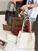 Bolso de mano retro muy elegante con patrón tejido, nuevo modelo de verano 2026, bolso de hombro de color liso a la moda, bolso tipo cubo de mano, moderno