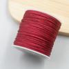 Una voluta de pulsera de pelo trenzado de mousse Un hilo de jade Pulsera tejida a mano DIY Colgante de collar Cordón para colgar Cuerda de mano Cuerda roja