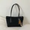 Nueva colección de primavera 2026: Bolso de mano para mujer estilo coreano, con un elegante diseño color block, gran capacidad y correa para el hombro, lo que lo convierte en un bolso tote versátil para ventas transfronterizas.