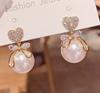 Moda Coreana Novos Brincos de Pérola Grandes em Formato de Coração de Pêssego Brincos Elegantes para Mulheres Exquisitos Versáteis Brincos Estilo Celebridade da Internet para Mulheres
