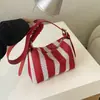 Bolso tejido a rayas para mujer, gran capacidad, estilo casual nuevo, bolso de hombro cruzado de nicho para el día a día, elegante bolso tipo almohada para ir al trabajo