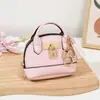 Mini bolso de concha de celebridad de internet llavero bolso de mano monedero colgante de bolsa portátil para guardar labial auriculares bolsa pequeña