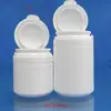 Moldeo por soplado por inyección 70ml botella con tapa abatible de lágrima chicle de xilitol pastilla botella de plástico vacía botella de polvo para dientes botella de polvo para cápsulas