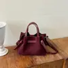 2026 Nova Bolsa de Ombro Grande Capacidade Estilo Coreano Versátil Bolsa de Nicho Moda Cor Sólida Bolsa Transversal Bolsa de Mão Estilo Balde