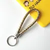 Llavero creativo llavero de cuerda de cuero cordón para llaves colgante de joyería cordón tejido fábrica de cuerda de cuero venta al por mayor