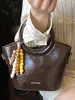 Bolso Cubo de Moda Casual Simple de Nicho Tendencia Primavera 2026 Nuevo Bolso de Hombro Cruzado para Mujer