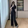 Macacão preto único super bonito senso de design decote V amarração afina elegante socialite novo estilo estilo Hepburn francês