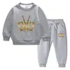 Traje de suéter para niños otoño e invierno 2023 estilo occidental nuevo para niños medianos y grandes grueso con forro polar cálido ropa de invierno traje de manga larga