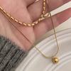 Novo minimalista de camada dupla de ouro Bead Titanium Steel Colar de camada dupla sobreposta versátil Retro Clavícula requintada elegante corrente para mulheres