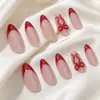 Nuevas uñas postizas rojas de almendra francesa de 24 piezas para Navidad con decoración de lazo, un superventas transfronterizo