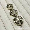 Botones metálicos negros con respaldo dorado y forma redonda para trajes, abrigos de lana tejidos, botones decorativos simples y versátiles para coser a mano