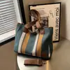 Bolso Tote de Lona de Gran Capacidad para Viajes Diarios Transfronterizos 2025 Nuevo Color Contrastante Correa Ancha para el Hombro Cruzado Bolso Popular para Mujer